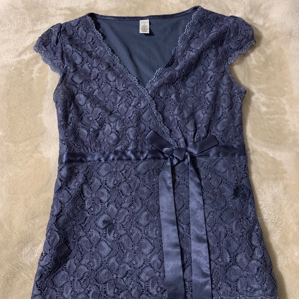 Woman’s blue lace top